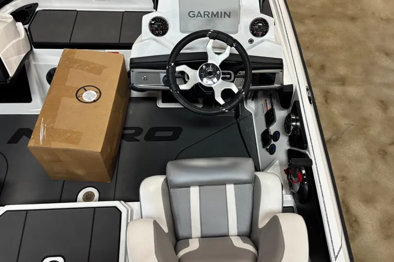 Slide: The Image of Interior of 2026 Nitro Z20 XL Pro boat with Garmin system and cardboard box. - 5
