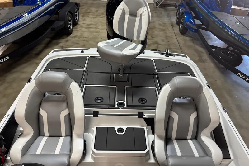Slide: The Image of 2026 Nitro Z20 XL Pro boat interior with three gray and white seats. - 8