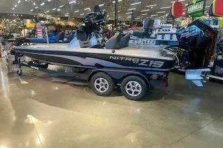The Image of 2026 Nitro Z19 XL Pro boat displayed in a showroom with sleek design and modern features. - 0