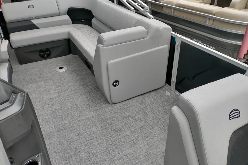 Slide: The Image of 2026 Sun Tracker Party Barge 20 DLX interior with gray seating and flooring. - 4