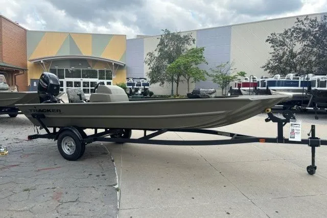 The Image of 2026 Tracker Grizzly 1754 SC boat on trailer, parked outdoors. - 0