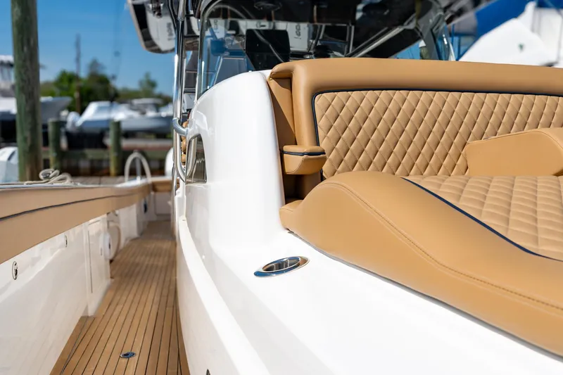 Slide: The Image of 2023 Valhalla Boatworks V-46 with luxurious tan seating and sleek design. - 13