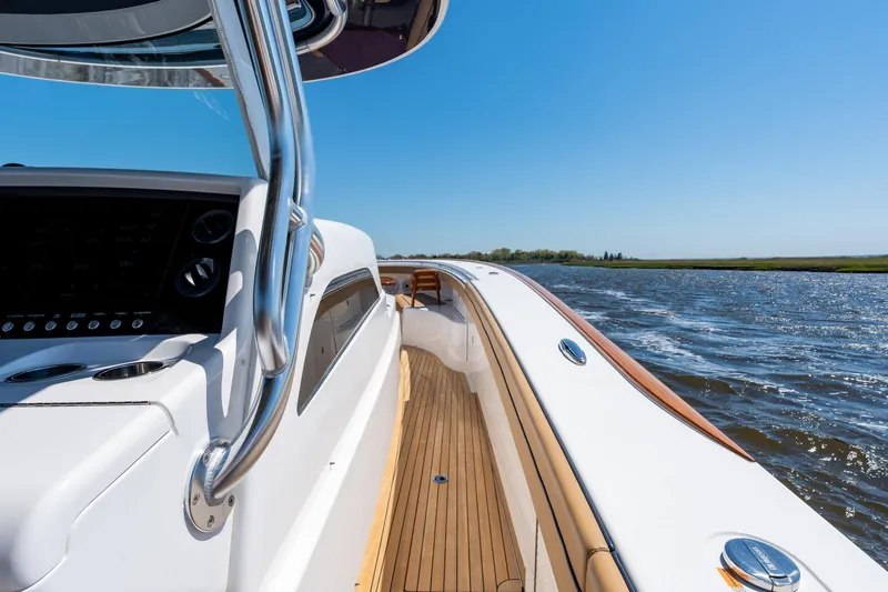 Slide: The Image of 2023 Valhalla Boatworks V-46 cruising on a sunny day, showcasing sleek design and craftsmanship. - 15
