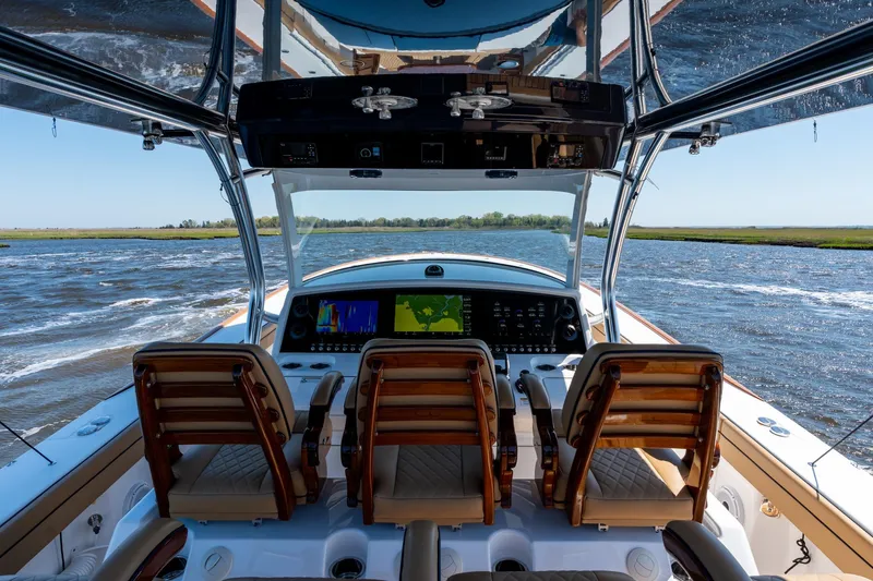 Slide: The Image of 2023 Valhalla Boatworks V-46 helm with advanced navigation system on open water. - 18