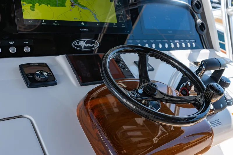 Slide: The Image of Steering console of 2023 Valhalla Boatworks V-46 with navigation display and controls. - 20