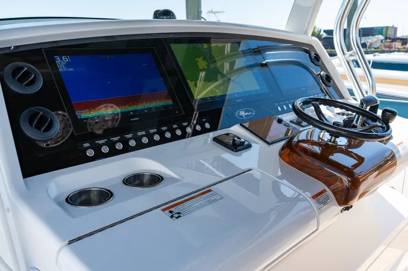 Slide: The Image of 2023 Valhalla Boatworks V-46 helm with advanced navigation displays and controls. - 21