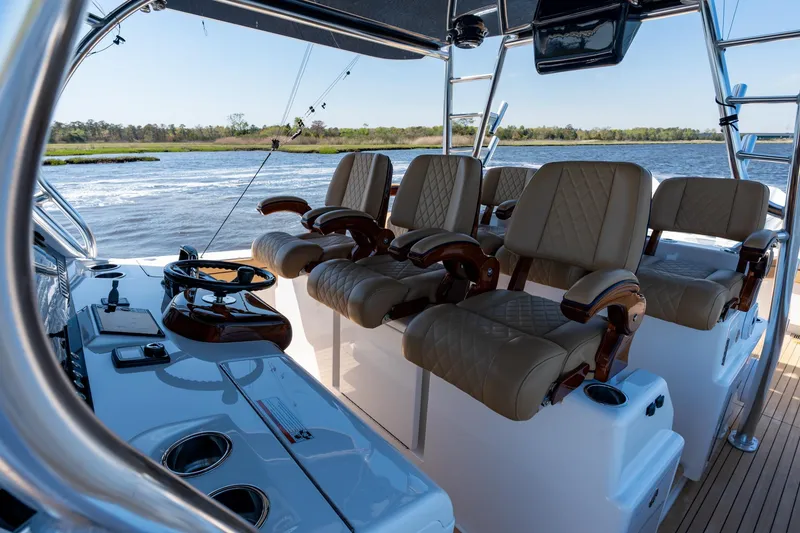 Slide: The Image of Luxurious 2023 Valhalla Boatworks V-46 helm with leather seating on open water. - 22