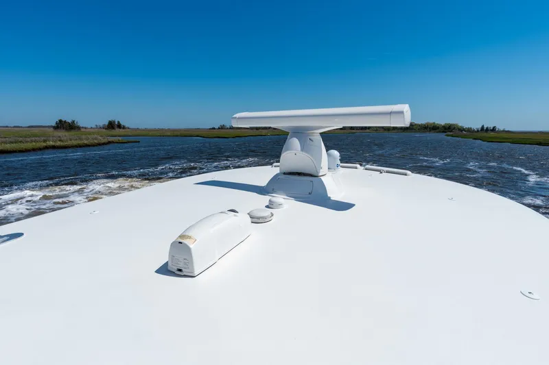 Slide: The Image of 2023 Valhalla Boatworks V-46 cruising on a clear day, showcasing sleek deck design. - 26