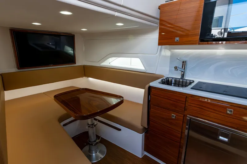 Slide: The Image of Luxurious interior of 2023 Valhalla Boatworks V-46 with seating, table, and kitchenette. - 27