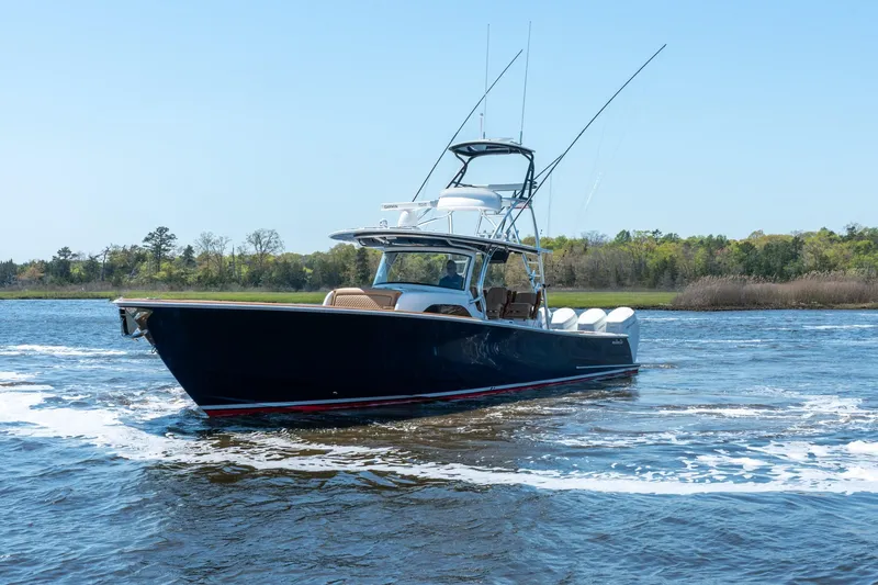 Slide: The Image of 2023 Valhalla Boatworks V-46 cruising on a calm lake with clear skies. - 3
