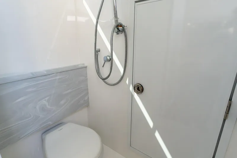 Slide: The Image of 2023 Valhalla V-46 boat bathroom with shower and toilet. - 30