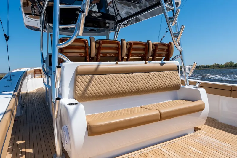 Slide: The Image of 2023 Valhalla Boatworks V-46 luxury seating on deck, cruising on open water. - 32