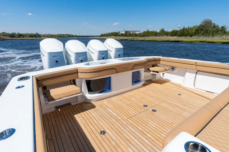 Slide: The Image of 2023 Valhalla Boatworks V-46 with quad Mercury engines, spacious deck, and luxurious seating. - 35
