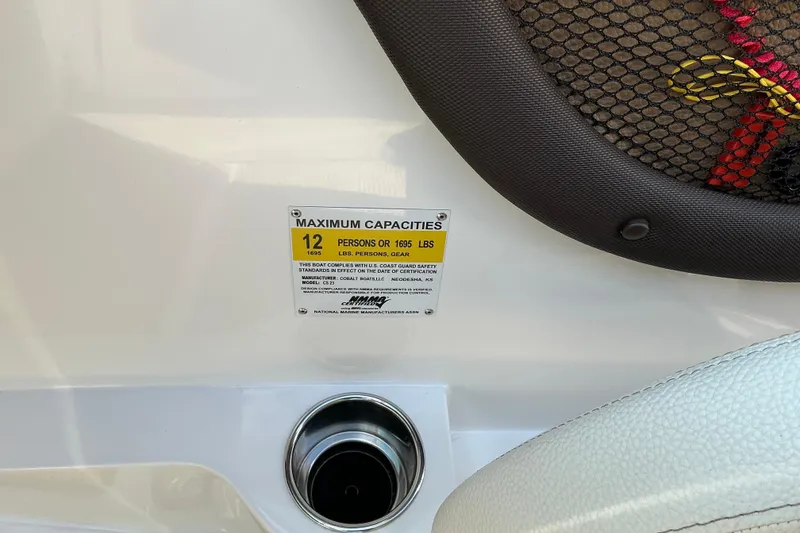Slide: The Image of 2019 Cobalt CS23 boat capacity label, seating for 12 or 1695 lbs. - 14