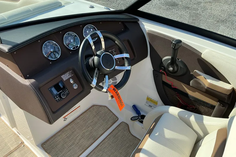 Slide: The Image of 2019 Cobalt CS23 boat dashboard with steering wheel and control panel. - 7