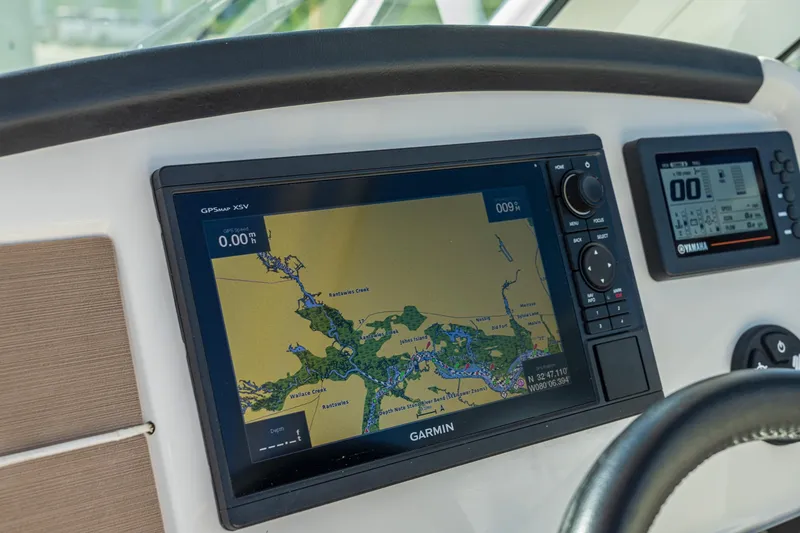 Slide: The Image of Garmin GPS display on 2027 Sailfish 245 DC boat dashboard. - 5