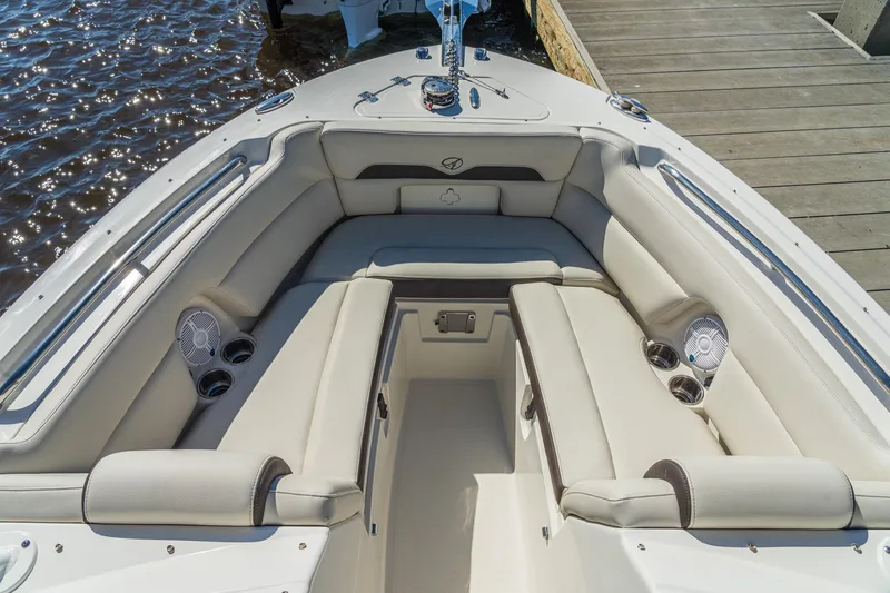 Slide: The Image of Luxurious seating area on 2027 Sailfish 245 DC boat, featuring cup holders and speakers. - 9
