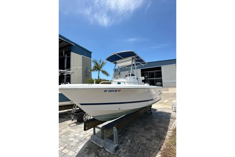 Slide: The Image of 2008 Pro-Line 20 Sport boat on display under clear blue sky. - 3
