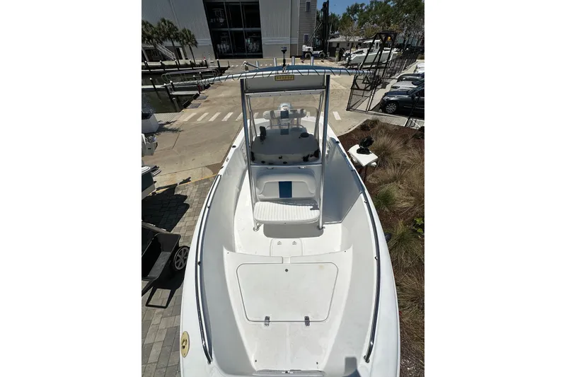 Slide: The Image of 2008 Pro-Line 20 Sport boat docked, showcasing spacious deck and sleek design. - 5