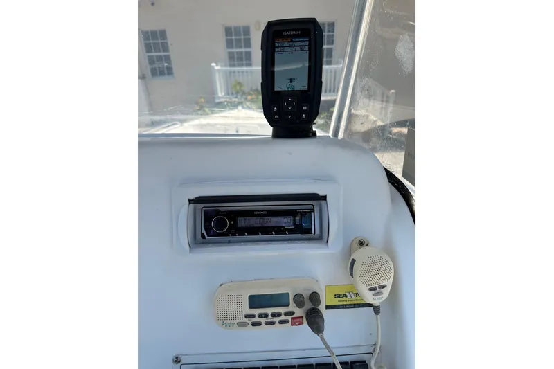 Slide: The Image of 2008 Pro-Line 20 Sport boat dashboard with Garmin GPS and Kenwood stereo system. - 9