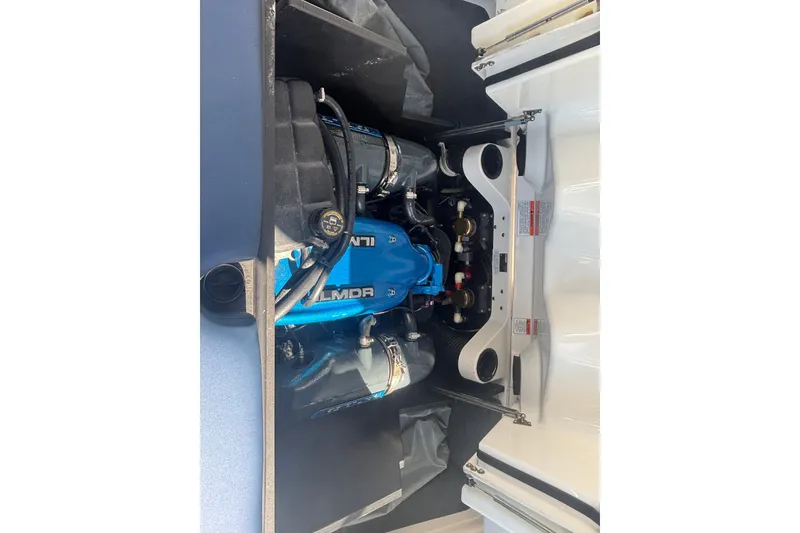 Slide: The Image of 2015 MasterCraft X23 engine compartment with Ilmor engine, showcasing detailed components. - 10