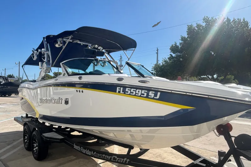 Slide: The Image of 2015 MasterCraft X23 boat on trailer, featuring sleek design and vibrant colors. - 3