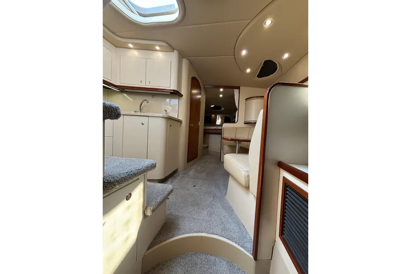 Slide: The Image of Luxurious interior of 2003 Cruisers Yachts 3470 Express with modern amenities and elegant design. - 15