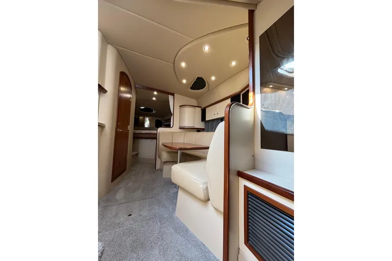 Slide: The Image of Interior of 2003 Cruisers Yachts 3470 Express, featuring elegant seating and modern design. - 17