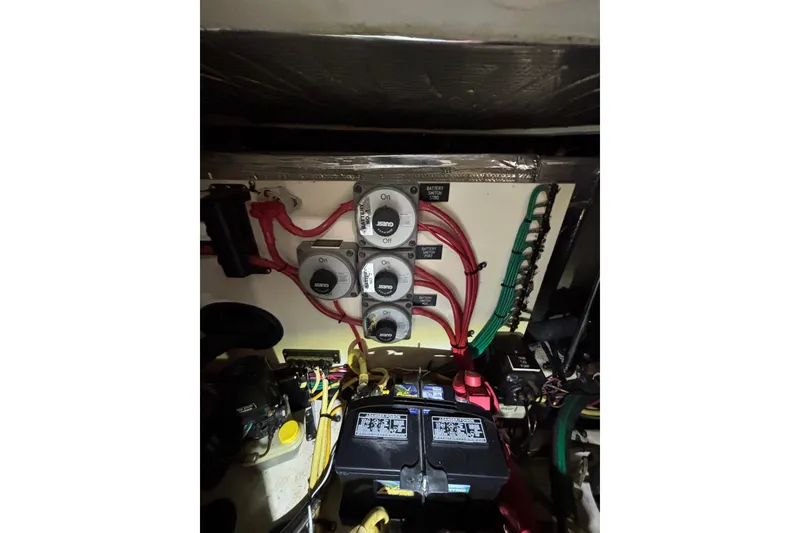 Slide: The Image of Electrical panel of a 2003 Cruisers Yachts 3470 Express with battery switches and wiring. - 31