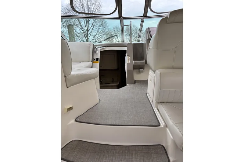 Slide: The Image of Interior of 2003 Cruisers Yachts 3470 Express, featuring elegant seating and modern design. - 6