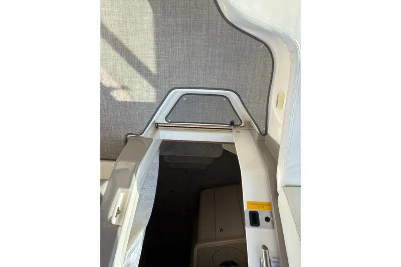 Slide: The Image of 2003 Cruisers Yachts 3470 Express cabin entrance with modern interior design. - 9