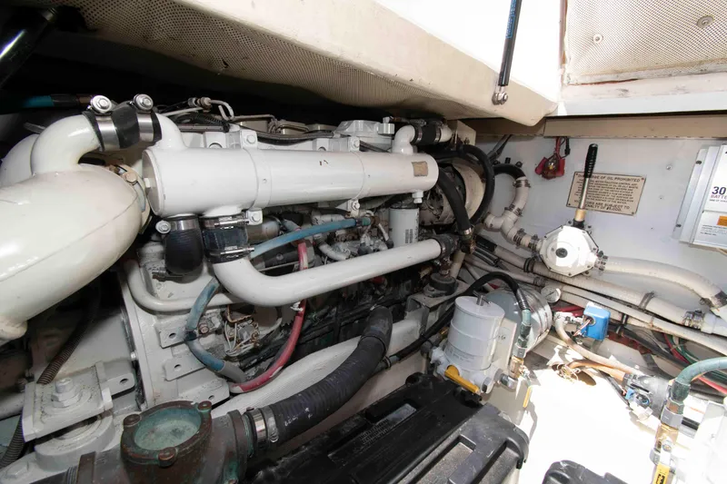 Slide: The Image of Engine room of a 1995 Bertram 30 Moppie boat, showcasing detailed mechanical components. - 21