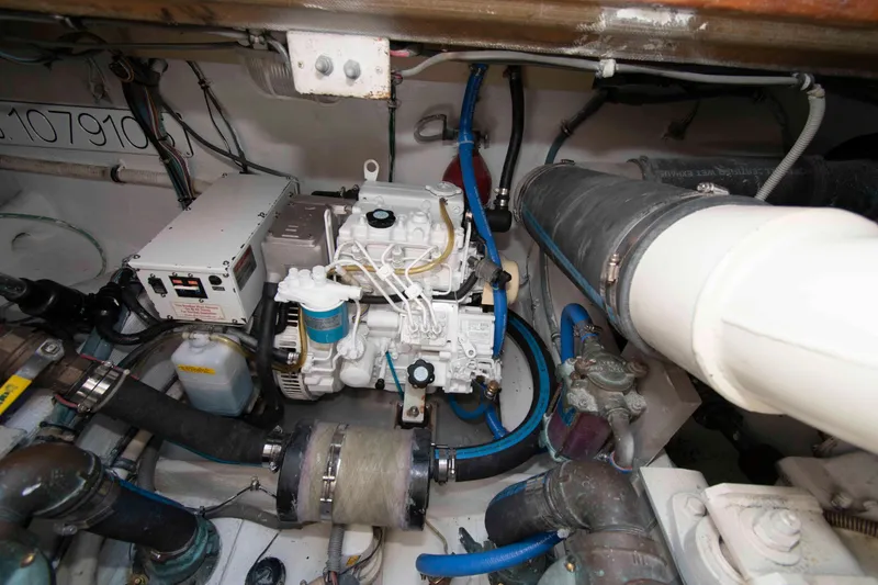 Slide: The Image of Engine room of a 1995 Bertram 30 Moppie boat with visible machinery and components. - 22
