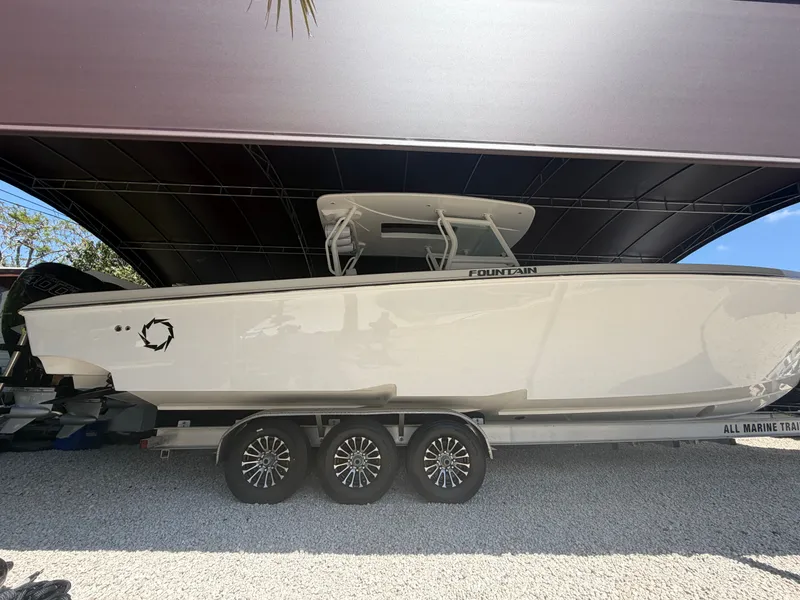 The Image of 2007 Fountain 38 Center Console boat on trailer under cover. - 0