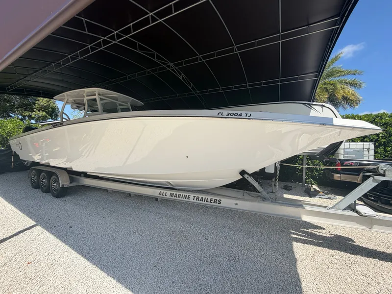 Slide: The Image of 2007 Fountain 38 Center Console on trailer under cover. - 1