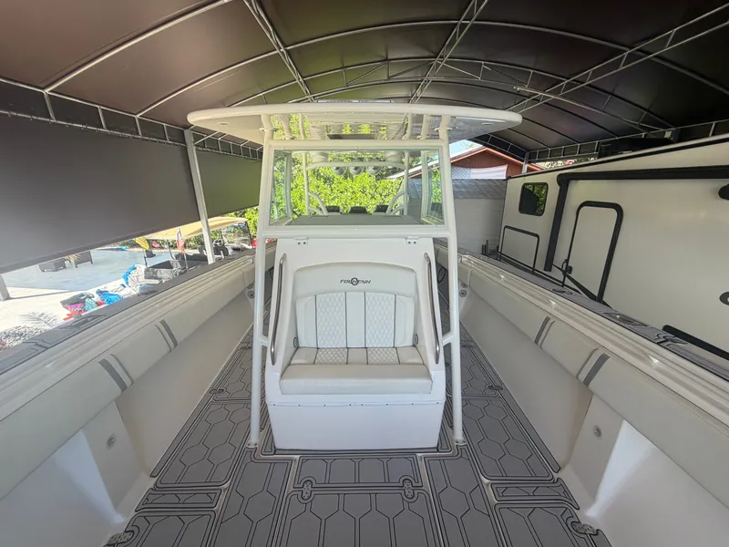Slide: The Image of 2007 Fountain 38 Center Console under covered area. - 11