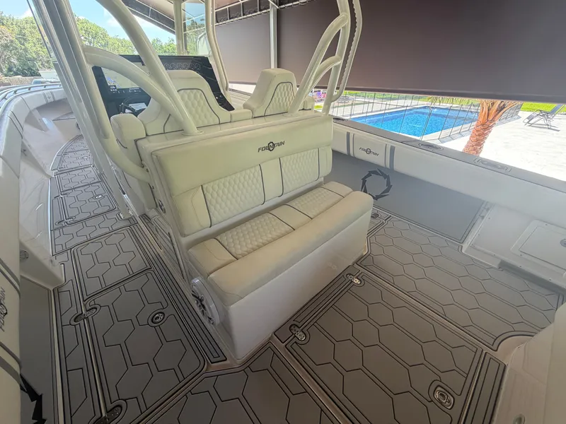 Slide: The Image of Interior of a 2007 Fountain 38 Center Console boat with luxurious seating. - 17