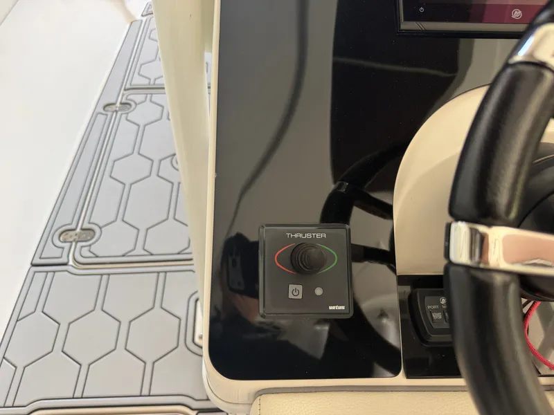 Slide: The Image of Control console of a 2007 Fountain 38 Center Console boat. - 22