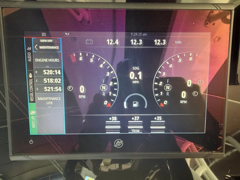 Slide: The Image of Fountain 38 Center Console 2007 boat display showing engine hours and voltage. - 7