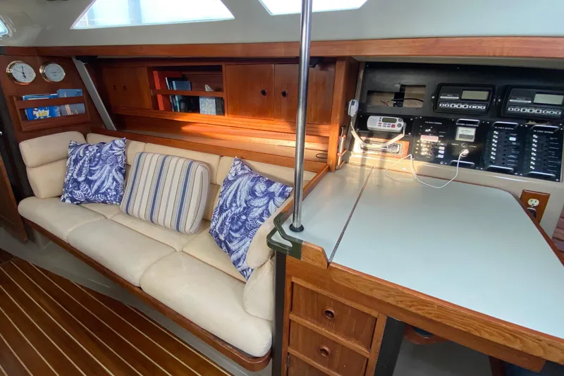Slide: The Image of Interior of 1987 C&C Mark III yacht with cozy seating and navigation station. - 2