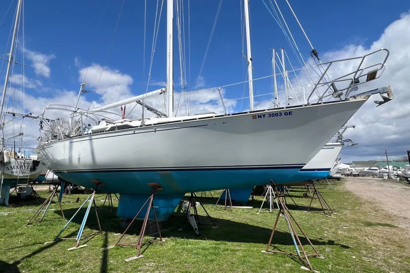 Slide: The Image of 1987 C&C Mark III sailboat on stands, clear sky background. - 21