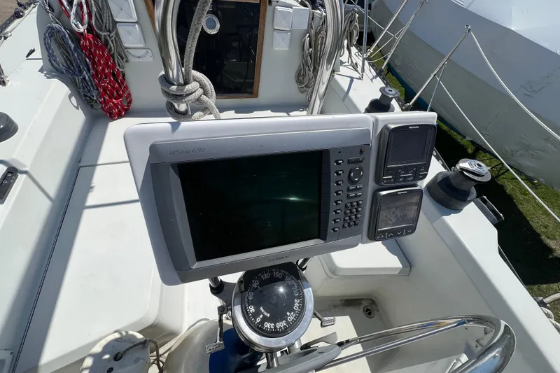 Slide: The Image of Sailboat cockpit with navigation equipment on a 1987 C&C Mark III. - 30