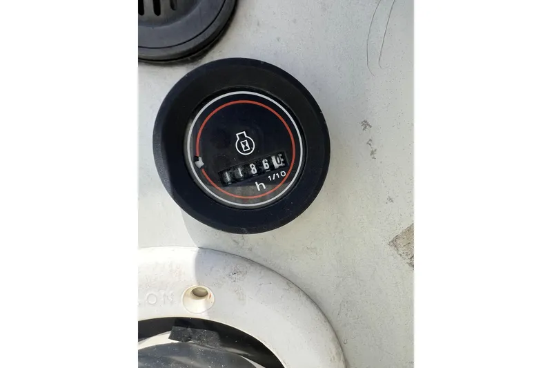 Slide: The Image of Hour meter on a 1987 C&C Mark III boat dashboard, displaying 1866 hours. - 34