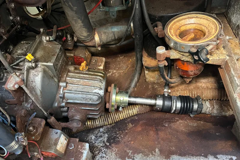 Slide: The Image of Engine compartment of a 1987 C&C Mark III, showcasing mechanical components and connections. - 35