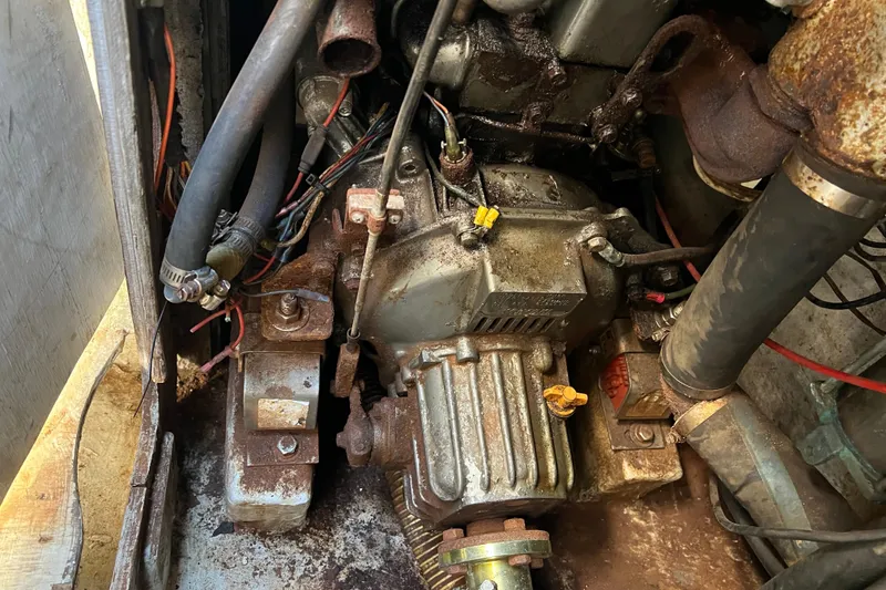 Slide: The Image of Engine compartment of a 1987 C&C Mark III, showing mechanical components and wiring. - 36