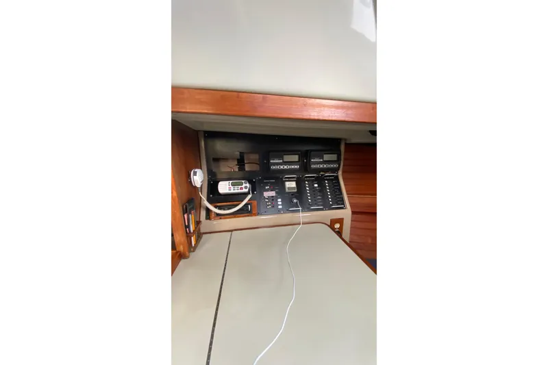 Slide: The Image of 1987 C&C Mark III yacht control panel with navigation and communication equipment. - 6