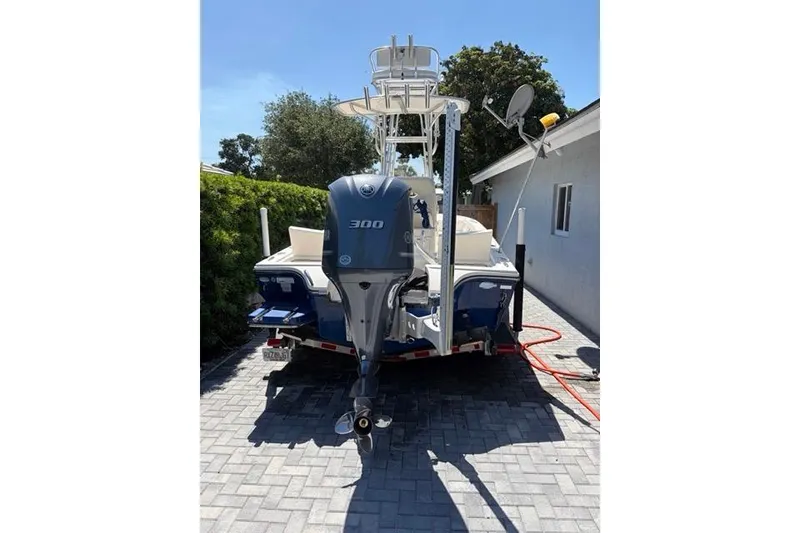 Slide: The Image of 2018 Pathfinder 2500 Hybrid boat with 300 horsepower engine on a driveway. - 11