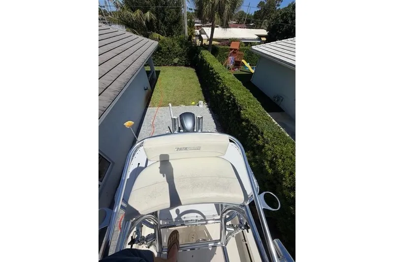 Slide: The Image of Overhead view of a 2018 Pathfinder 2500 Hybrid boat parked in a driveway. - 14