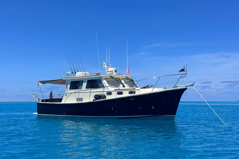 Slide: The Image of 2017 Eastern 35 Casco Bay boat anchored in clear blue ocean under a sunny sky. - 4