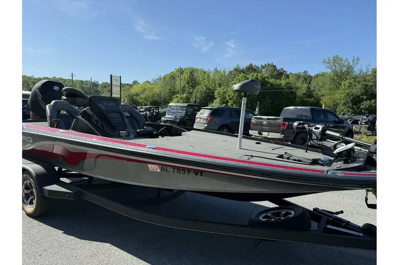 Slide: The Image of 2023 Nitro Z20 Pro bass boat on trailer in parking lot. - 7
